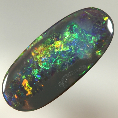 SOLID BLACK OPAL Bright sparkles of orange and green with a touch blue